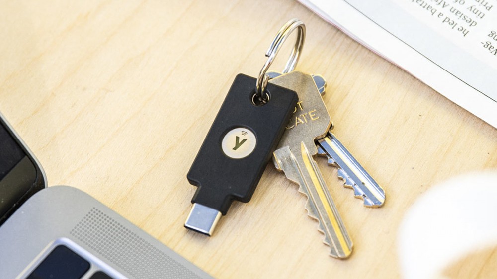 A Yubico 5C NFC key on a keychain with other analog keys.
