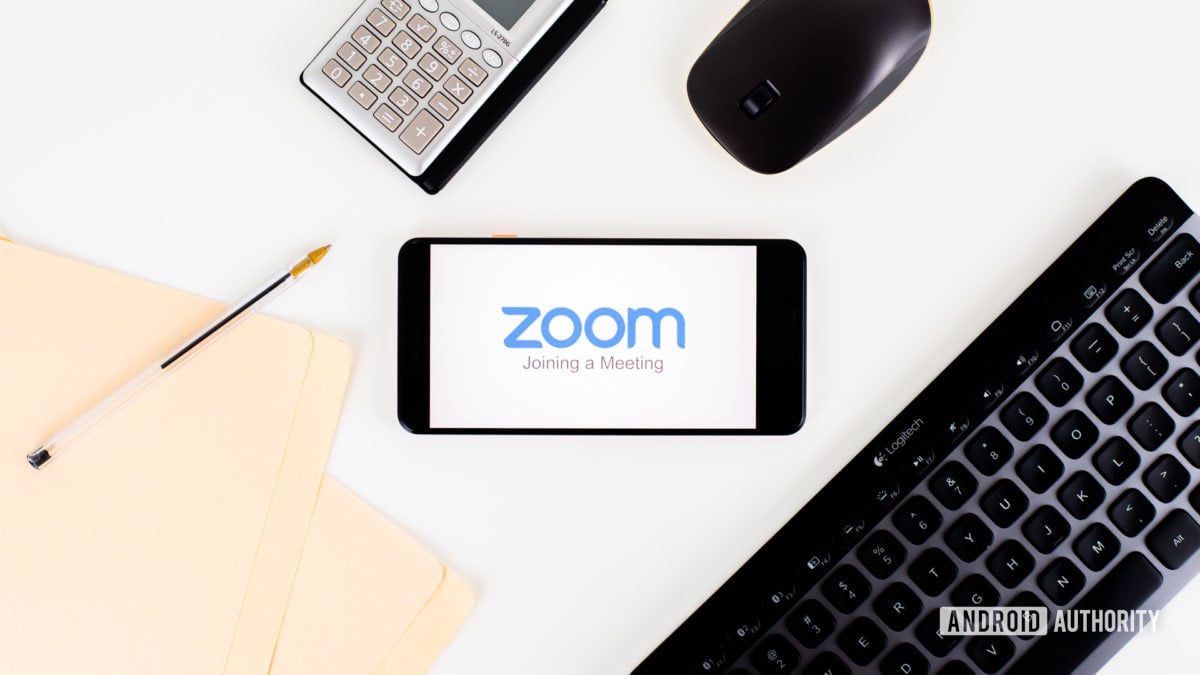 Zoom-Meetings-on-smartphone-next-to-office-equipment-stock-1-1200x675-2