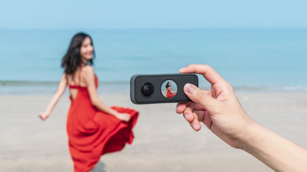 The Insta360 One X2 on a beach showing a multiangle shot.