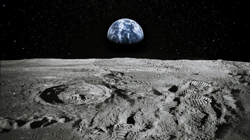 A view of the Earth rising over the Moon's horizong.