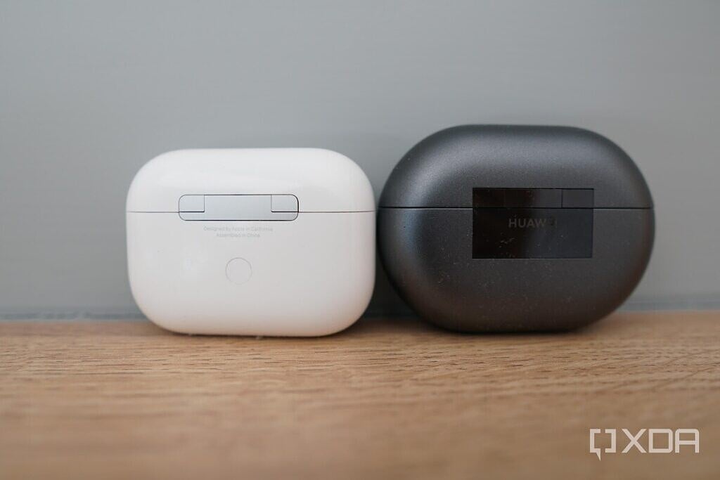 Case of Apple AirPods Pro and Huawei FreeBuds Pro on a table for comparison