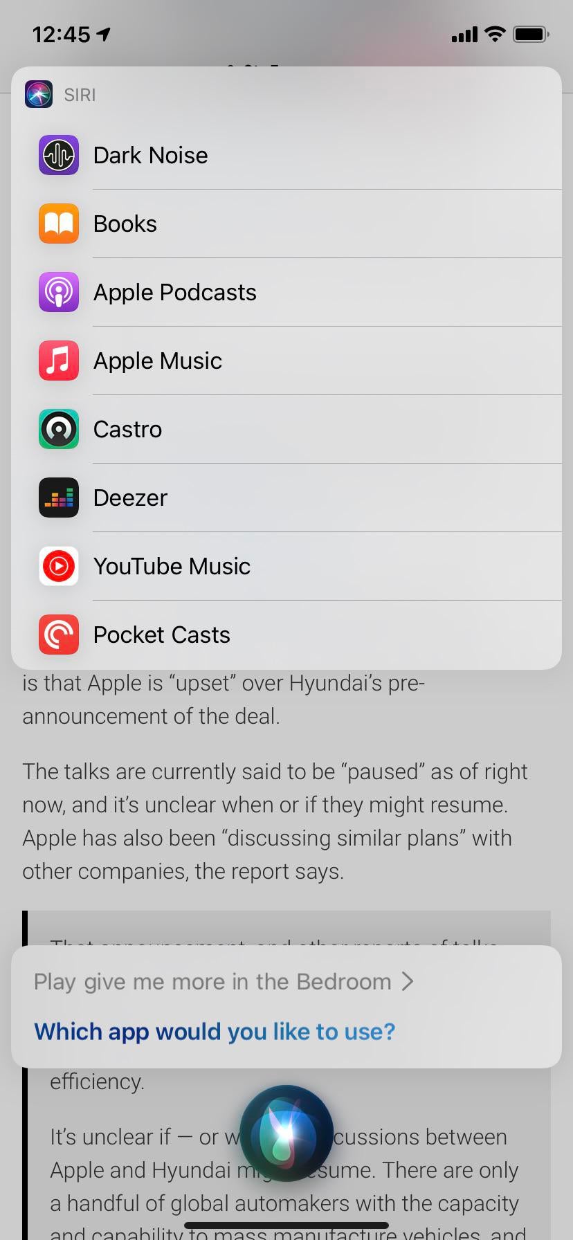 A screenshot of the Siri interface in iOS 14.5 asking the user to pick the default app for music streaming