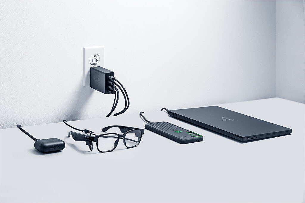 Razer Gan Charger connected to glasses, earbuds, phone, and laptop
