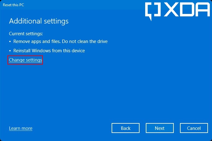 Windows 11 reset confirmation page with a red highlight on the Change settings option