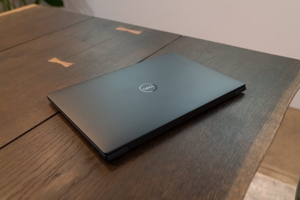 Dell XPS 13 Plus Graphite with lid closed on a wooden desk