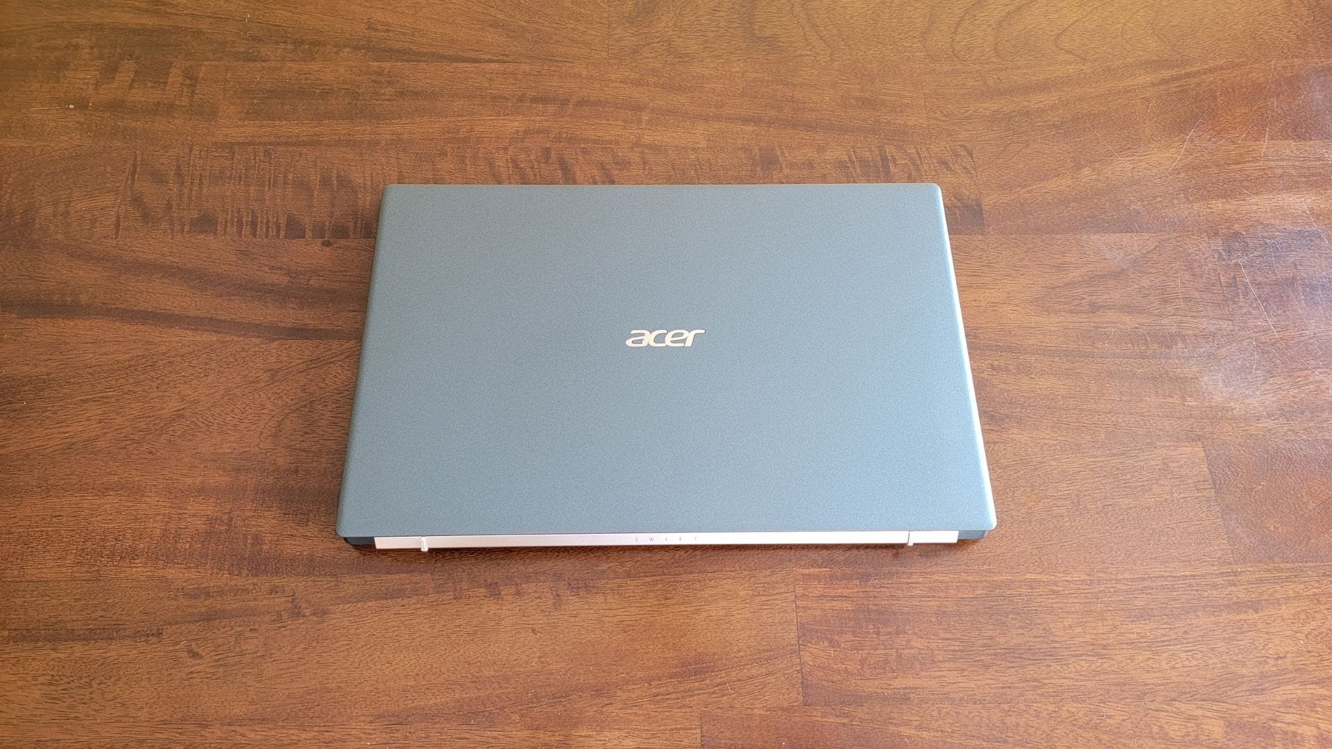 acer swift 5 laptop closed on a wooden table