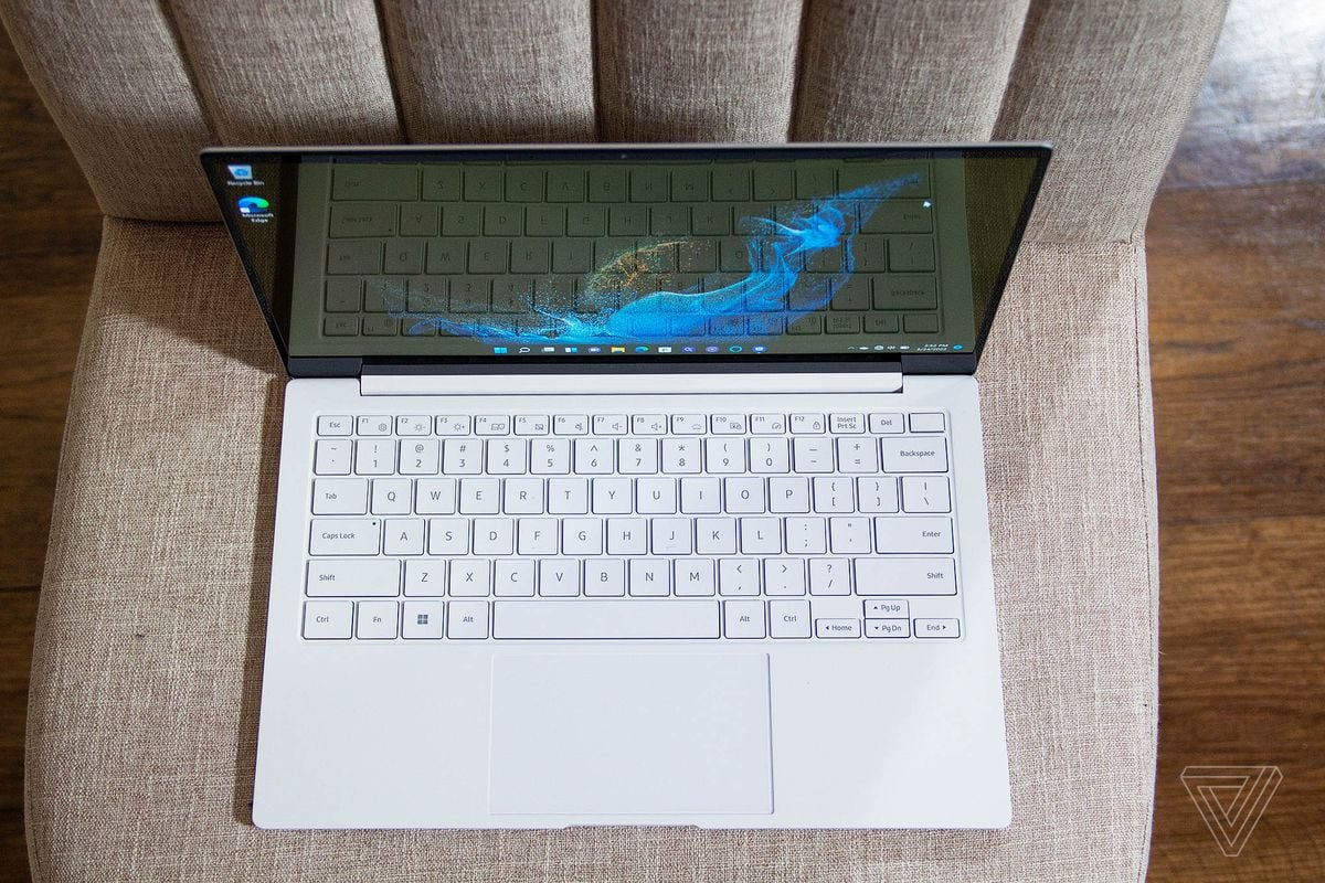 The keyboard of the Galaxy Book 2 Pro seen from above on a white plush chair.
