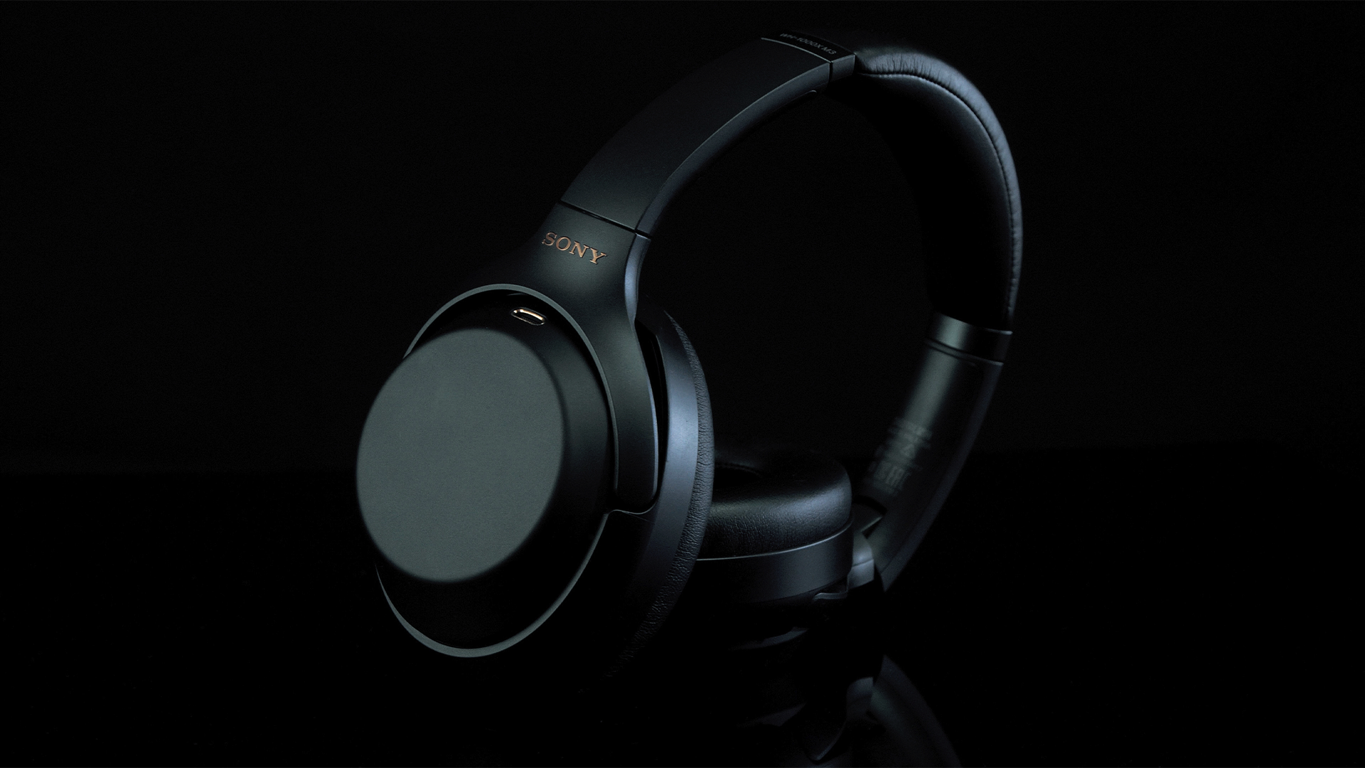 The Sony WH-1000XM3 headphones on a black background.