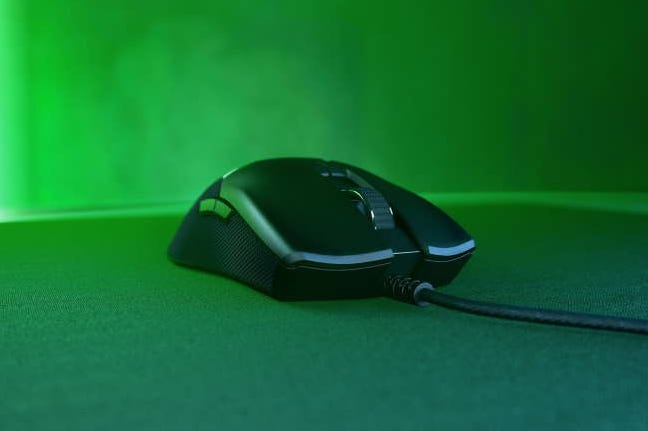 Razer Viper mouse on table with green RGB lighting