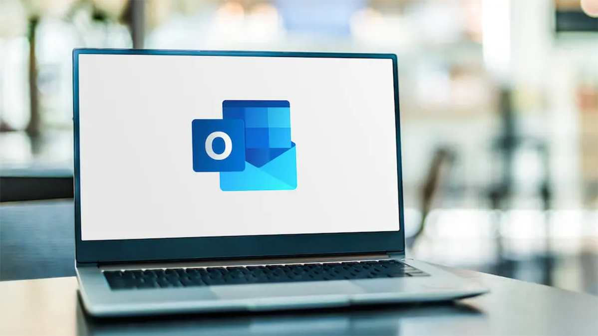 Microsoft Outlook logo on a laptop.