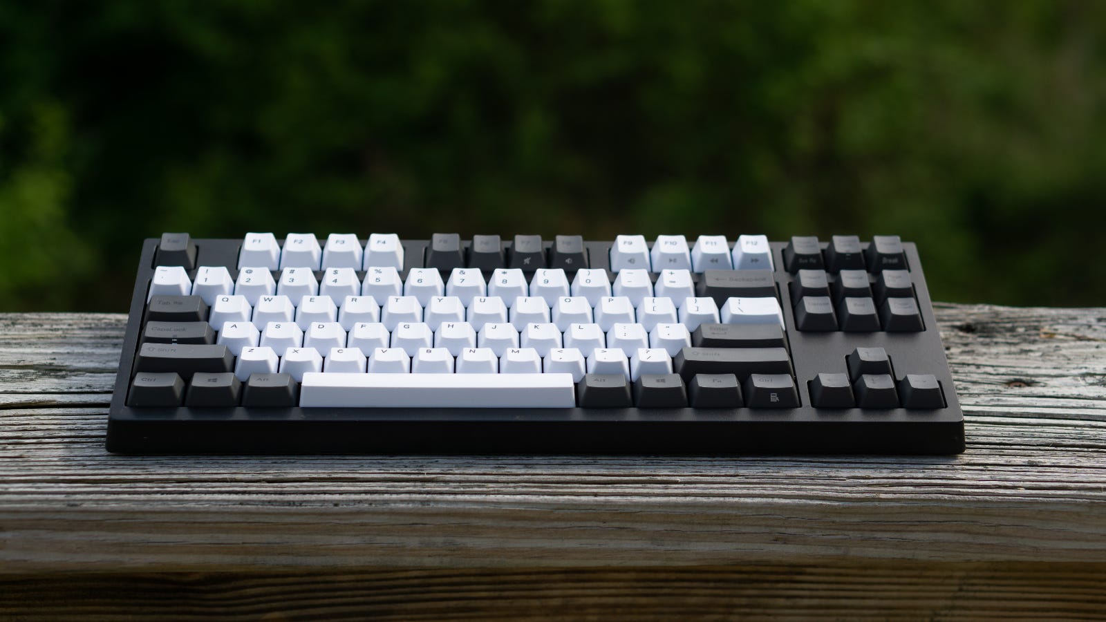 A black and white traditional mechanical keyboard