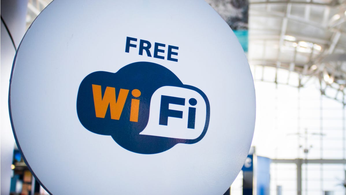 A sign in an airport reading "Free Wi-Fi."