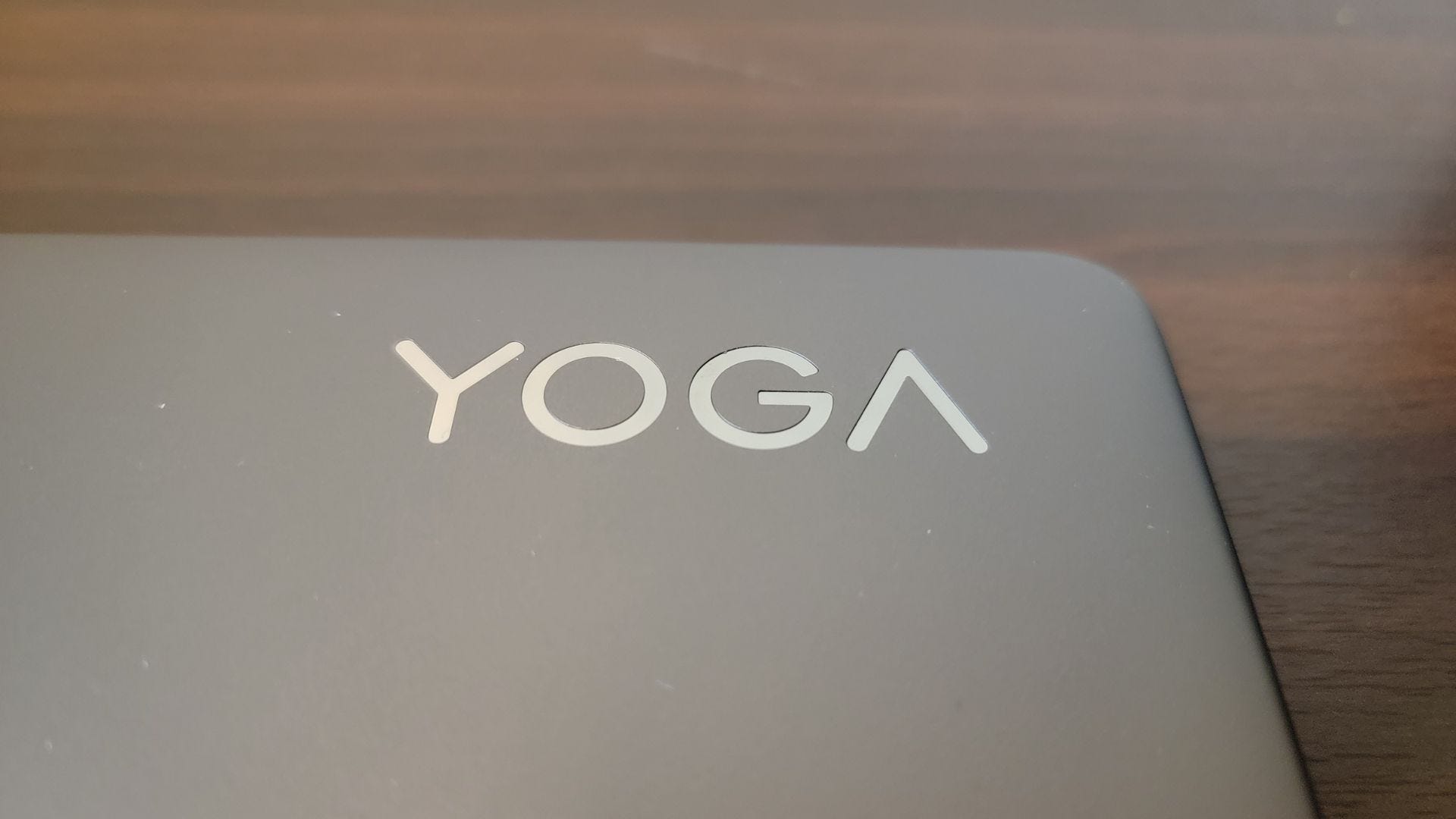 closeup of the yoga symbol on the lenovo 9i laptop