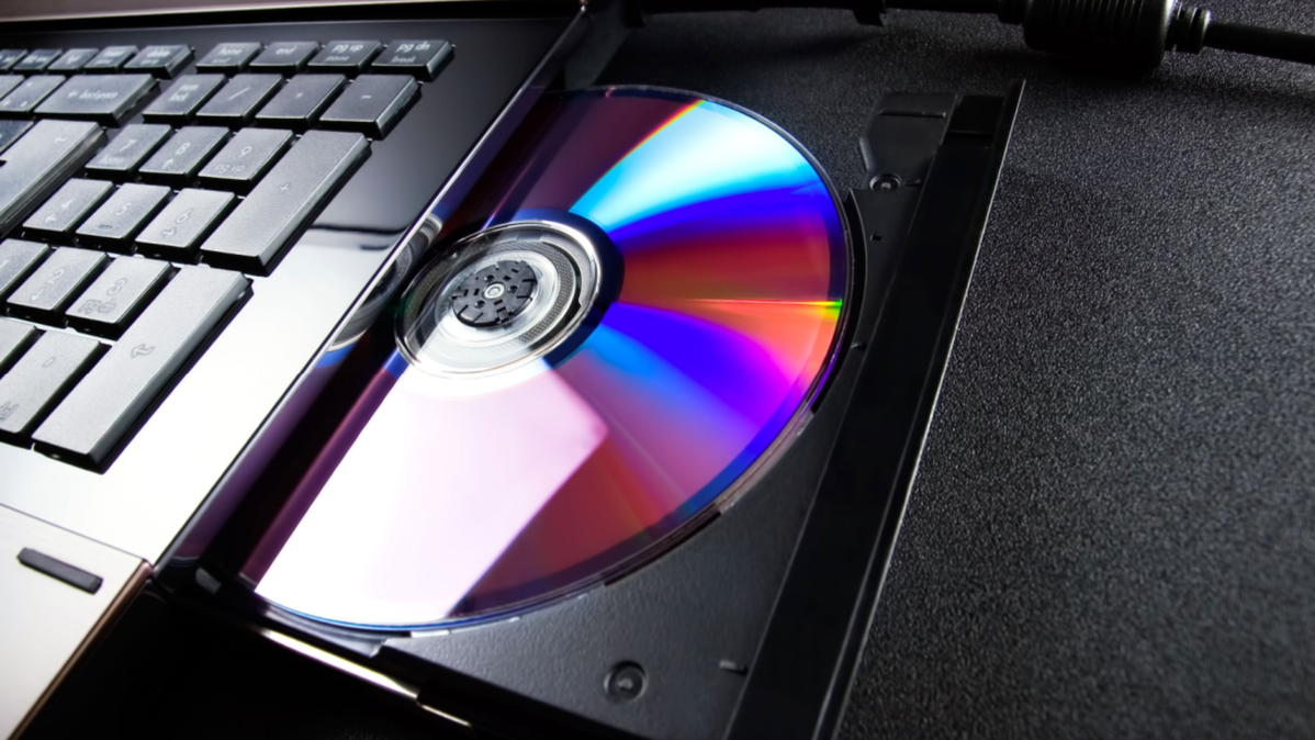 Header. DVD in a laptop DVD drive.