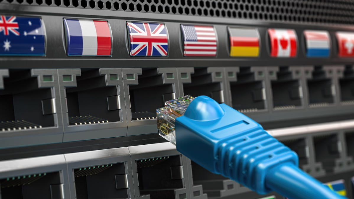 Plugging an Ethernet cable into ports with different country's flags on them.