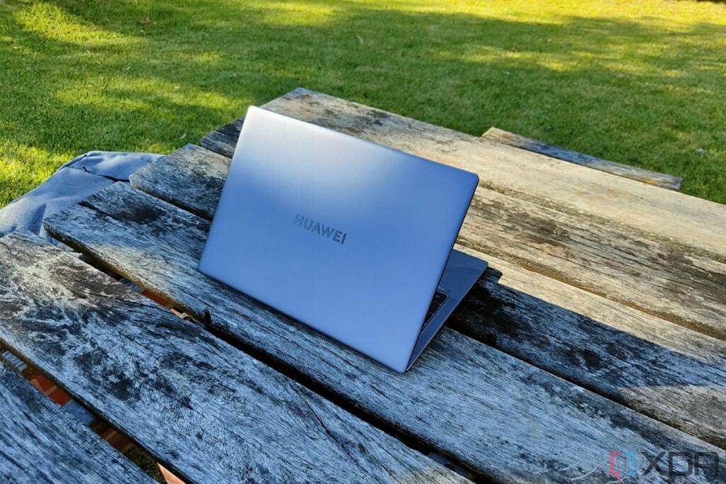 Angled rear view of the Huawei MateBook X Pro on a wooden table