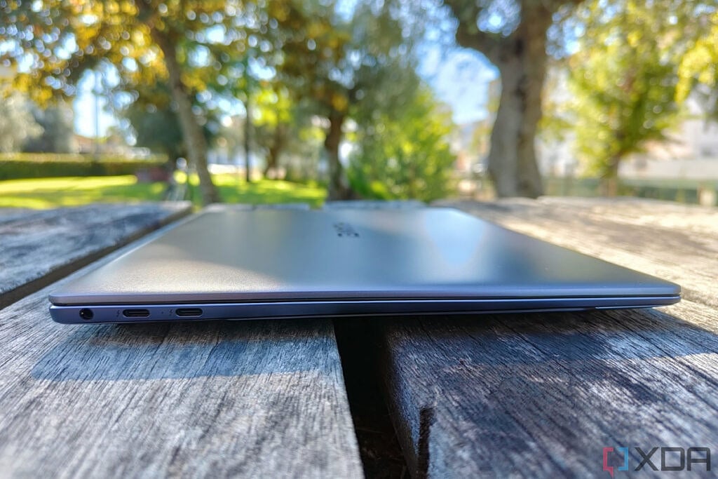 Side view of the Huawei mateBook X Pro with the lid closed, showing two THunderbolt 4 ports and a 3.5mm headphone jack