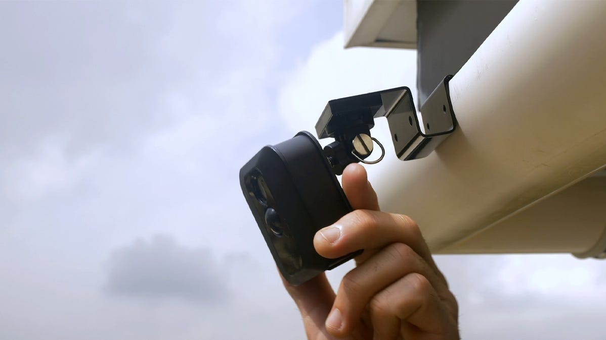 A camera mount attached to a home's gutter system.