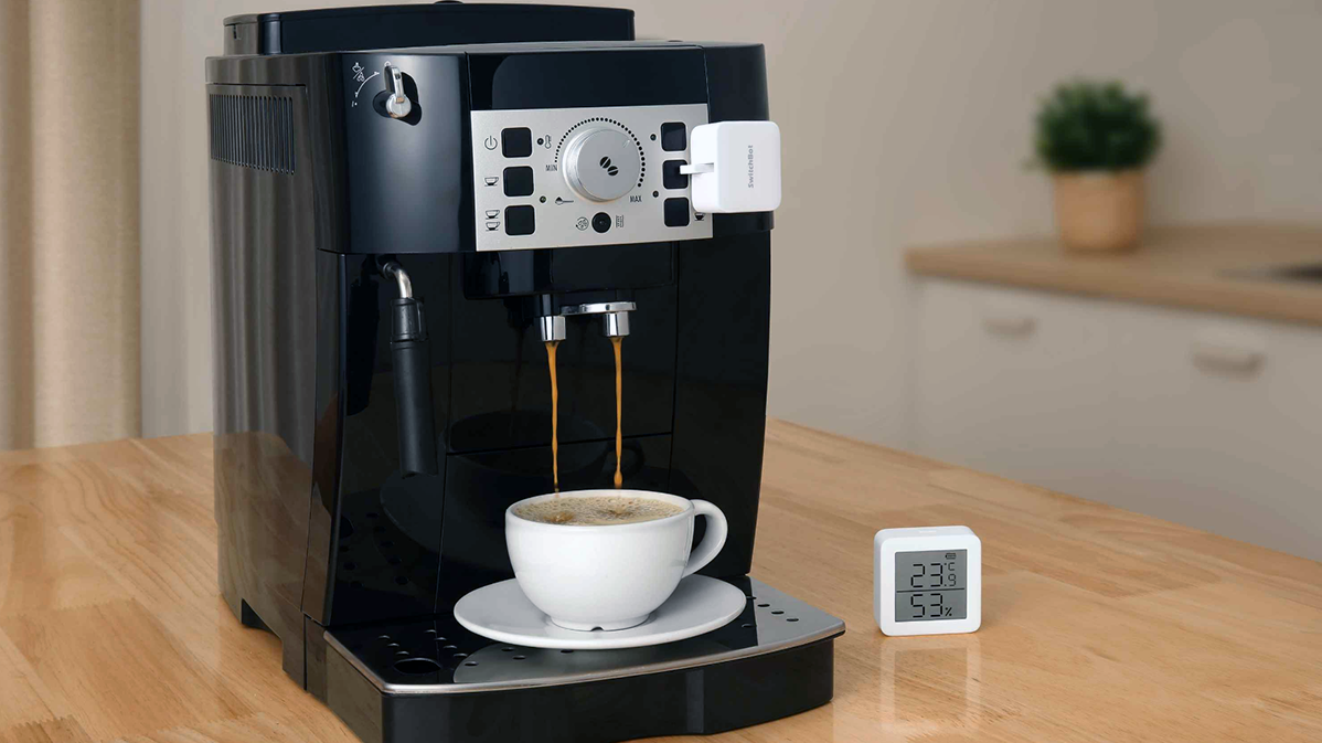 SwitchBot Bot being used with a coffee maker