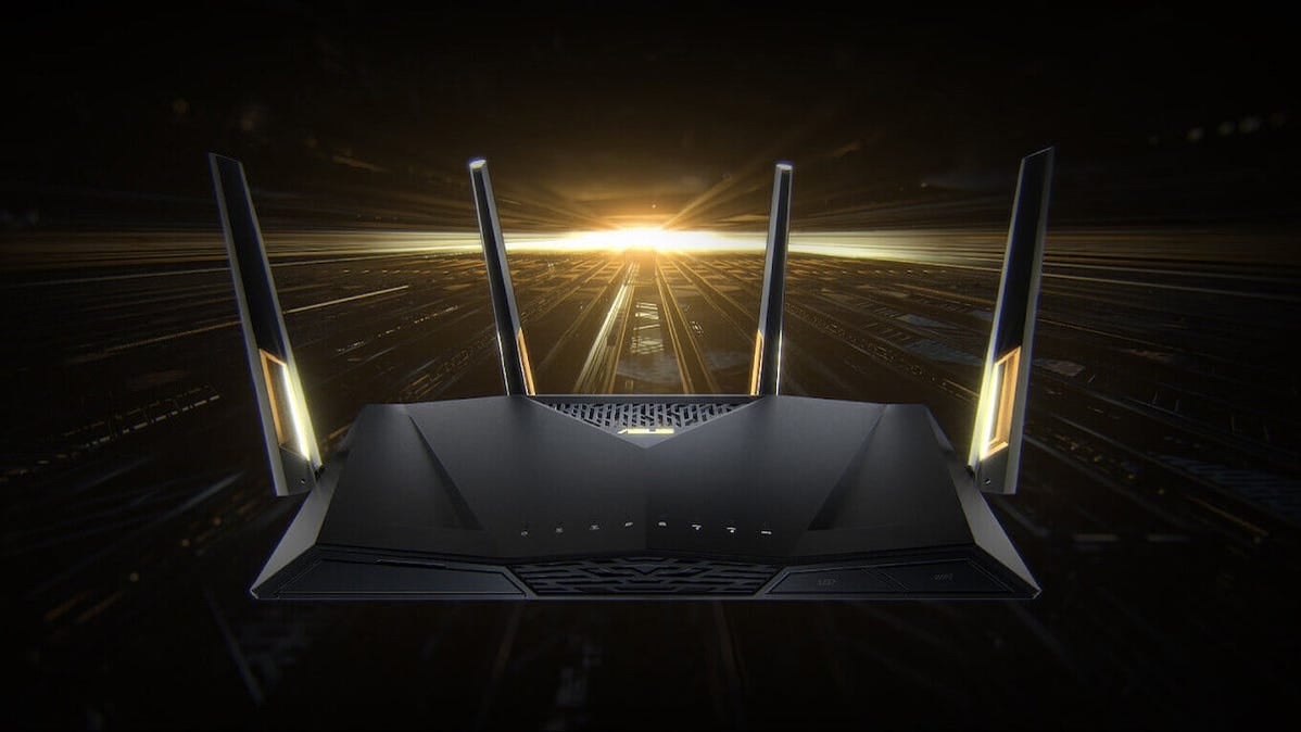An Asus RT-AX88U Wi-Fi router on a stylized golden background.