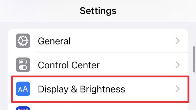 Select "Display & Brightness" in your iPhone's settings menu.