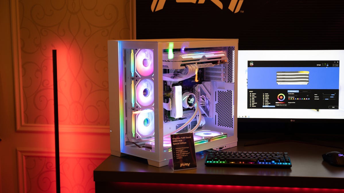 A gaming PC with Kingston memory, RGB fans, lights, MSI CPU cooler, and GeForce RTX GPU.