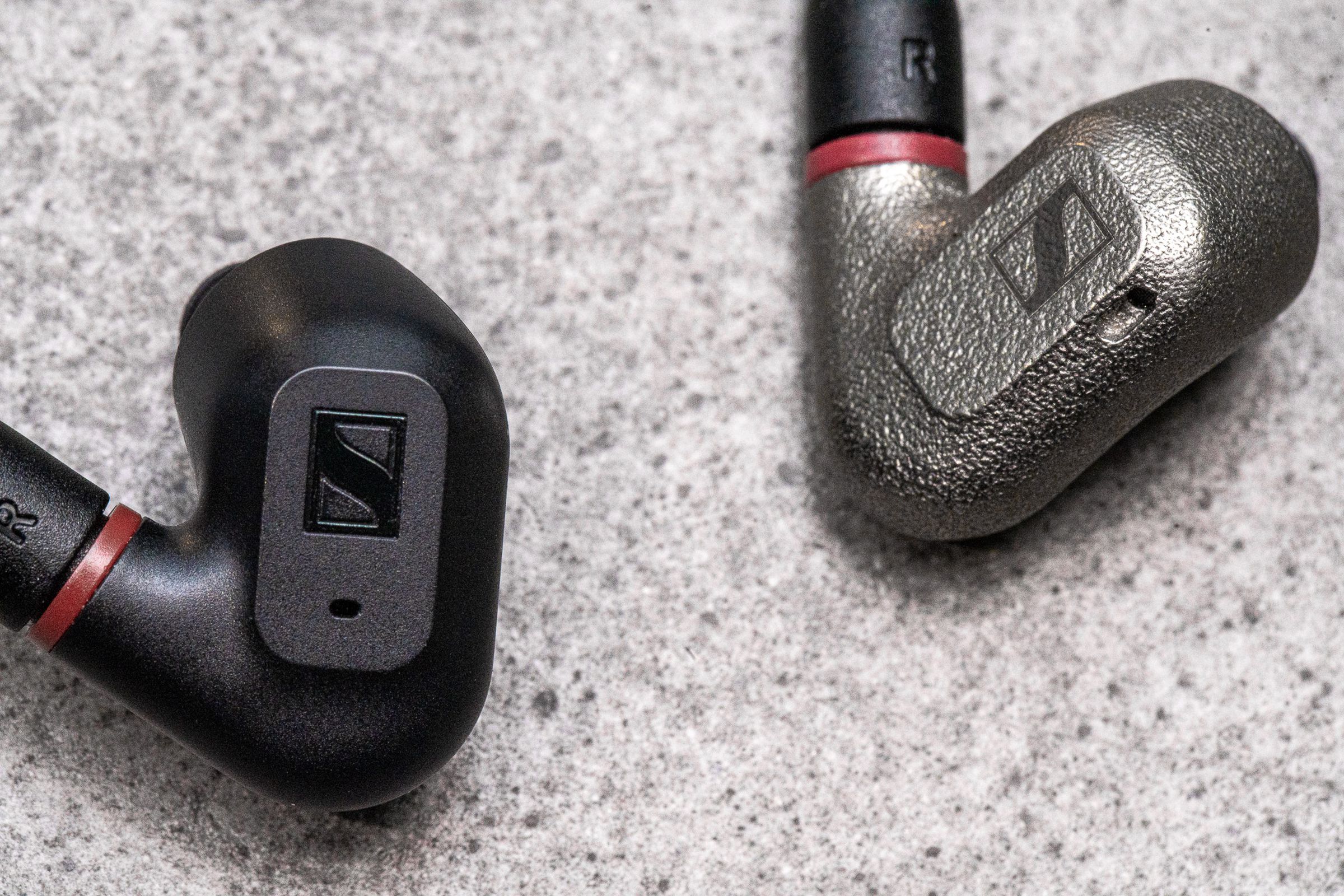 A photo comparing the case material of Sennheiser’s IE 200 and IE 600 earbuds.