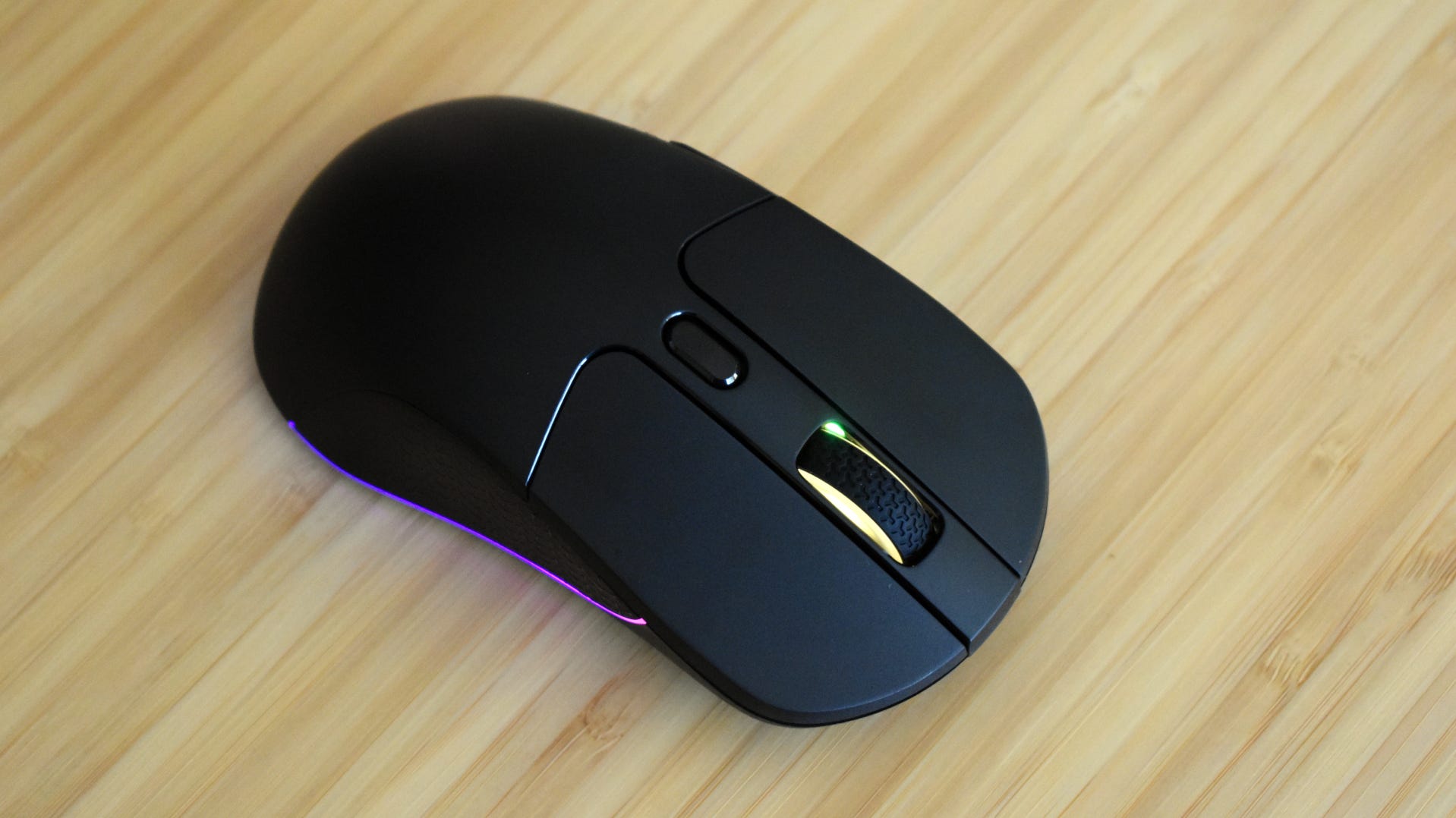Keychron M3 Gaming mouse resting on wood desktop