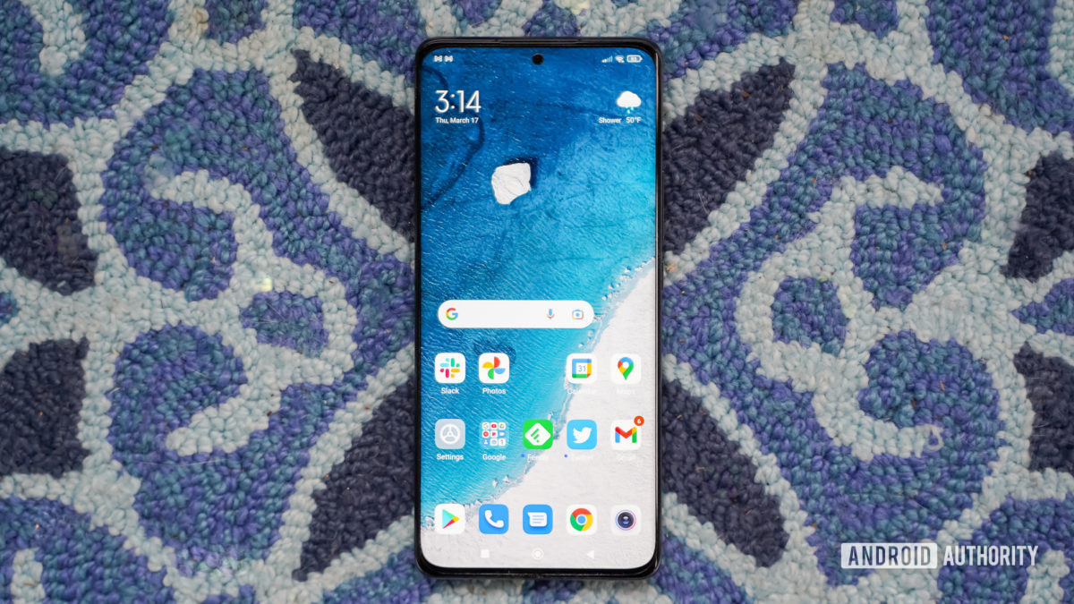 Xiaomi 12 Pro display on blue carpet